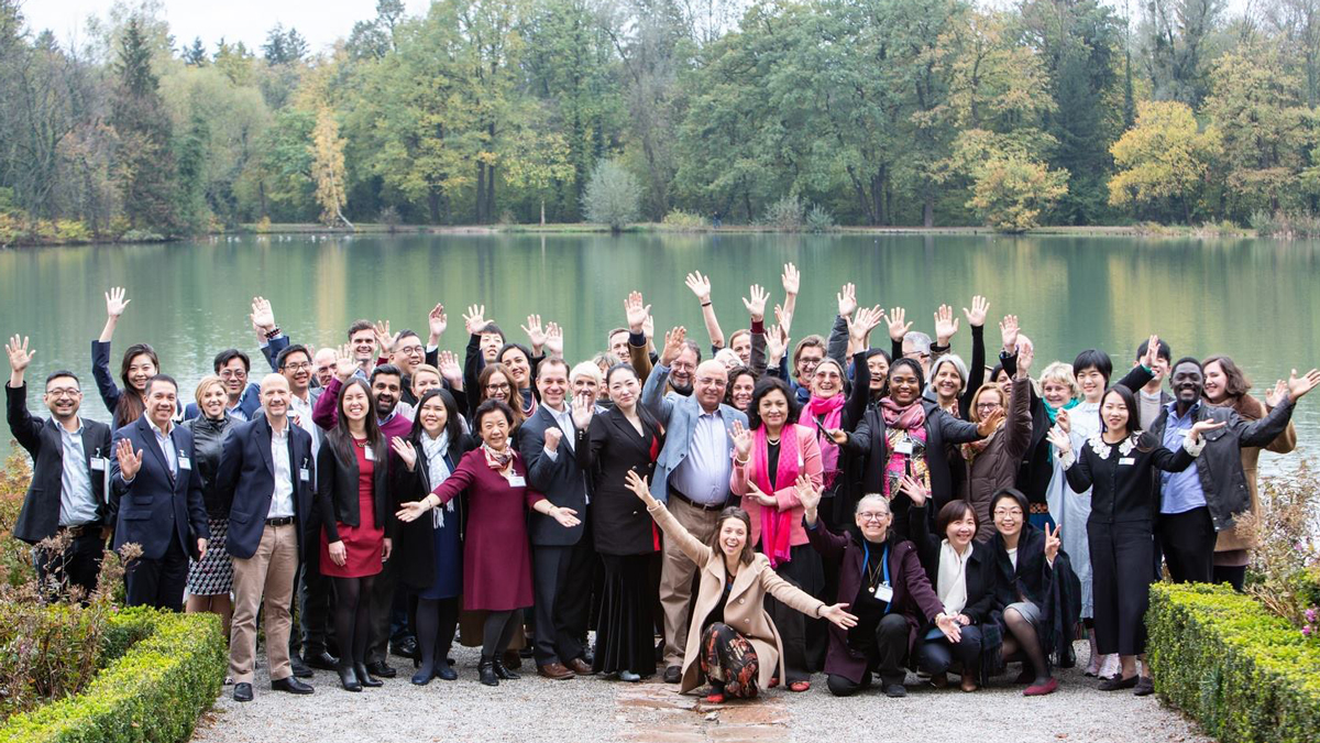 Participants of New Horizons in Social Investment – Global Exchange for Action and Impact pose for a group photo outside Schloss Leopoldskron