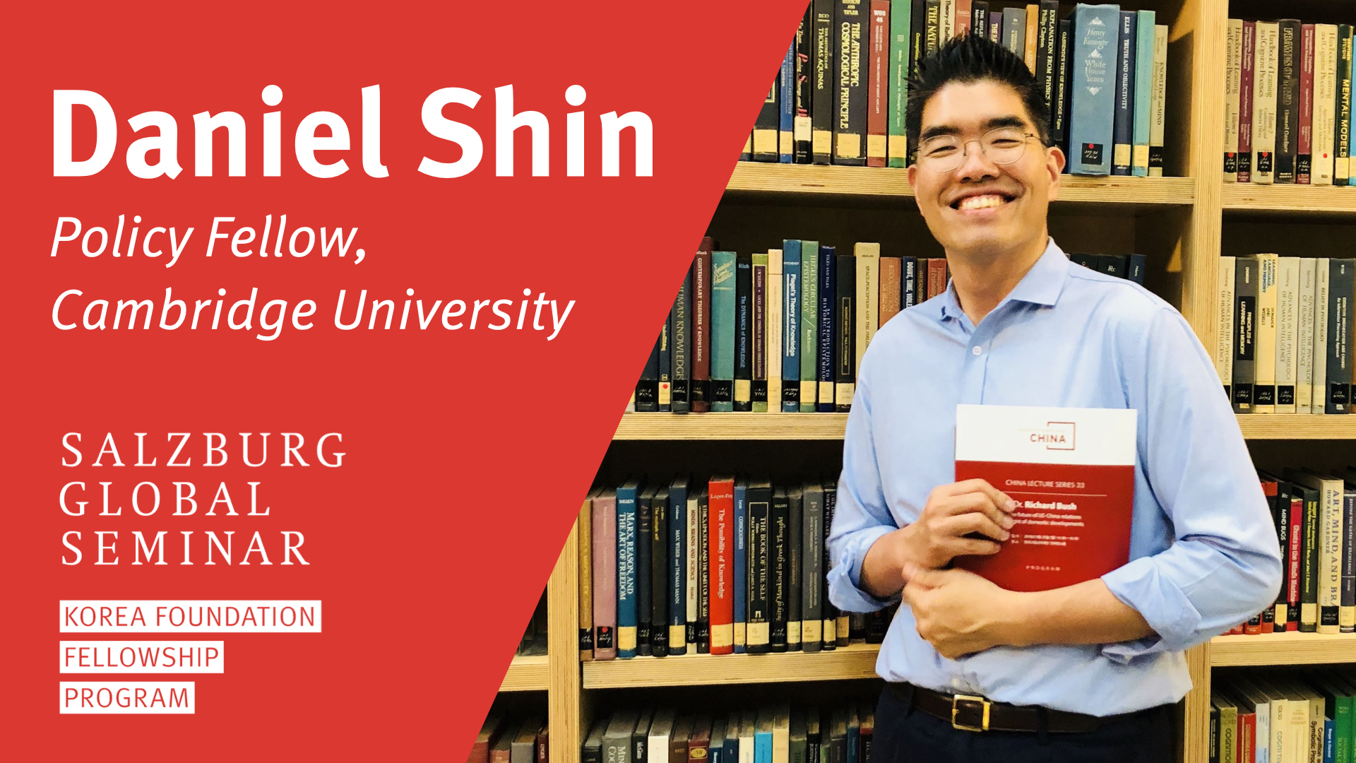 Picture of Daniel shin, policy Fellow, holding a book